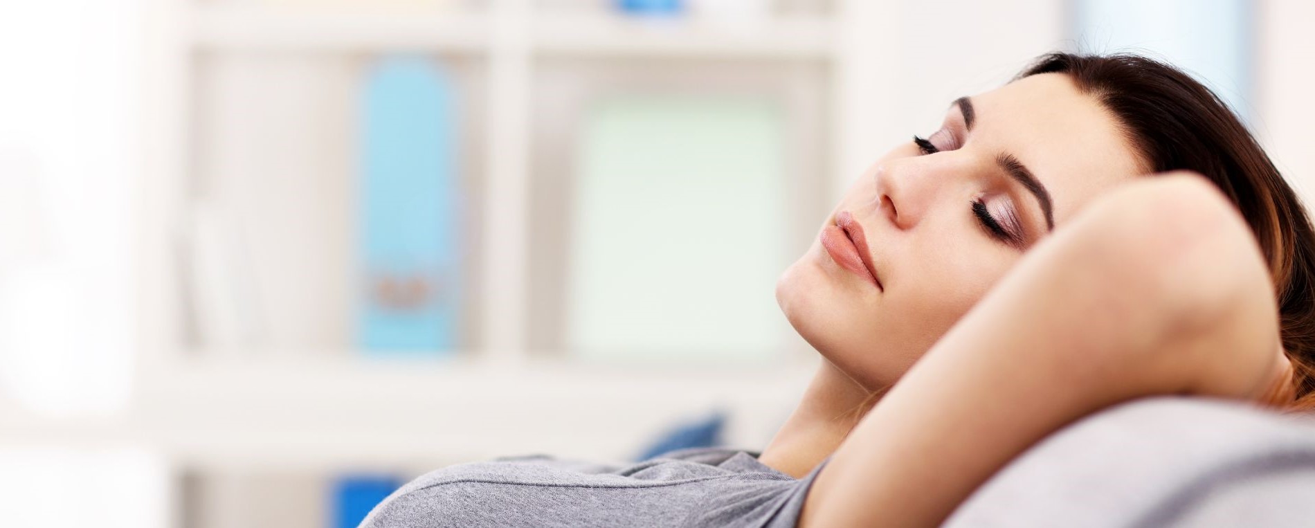 Woman breathing fresh air in her home